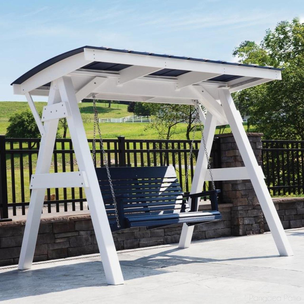 White swing stand with a blue swing in a backyard setting
