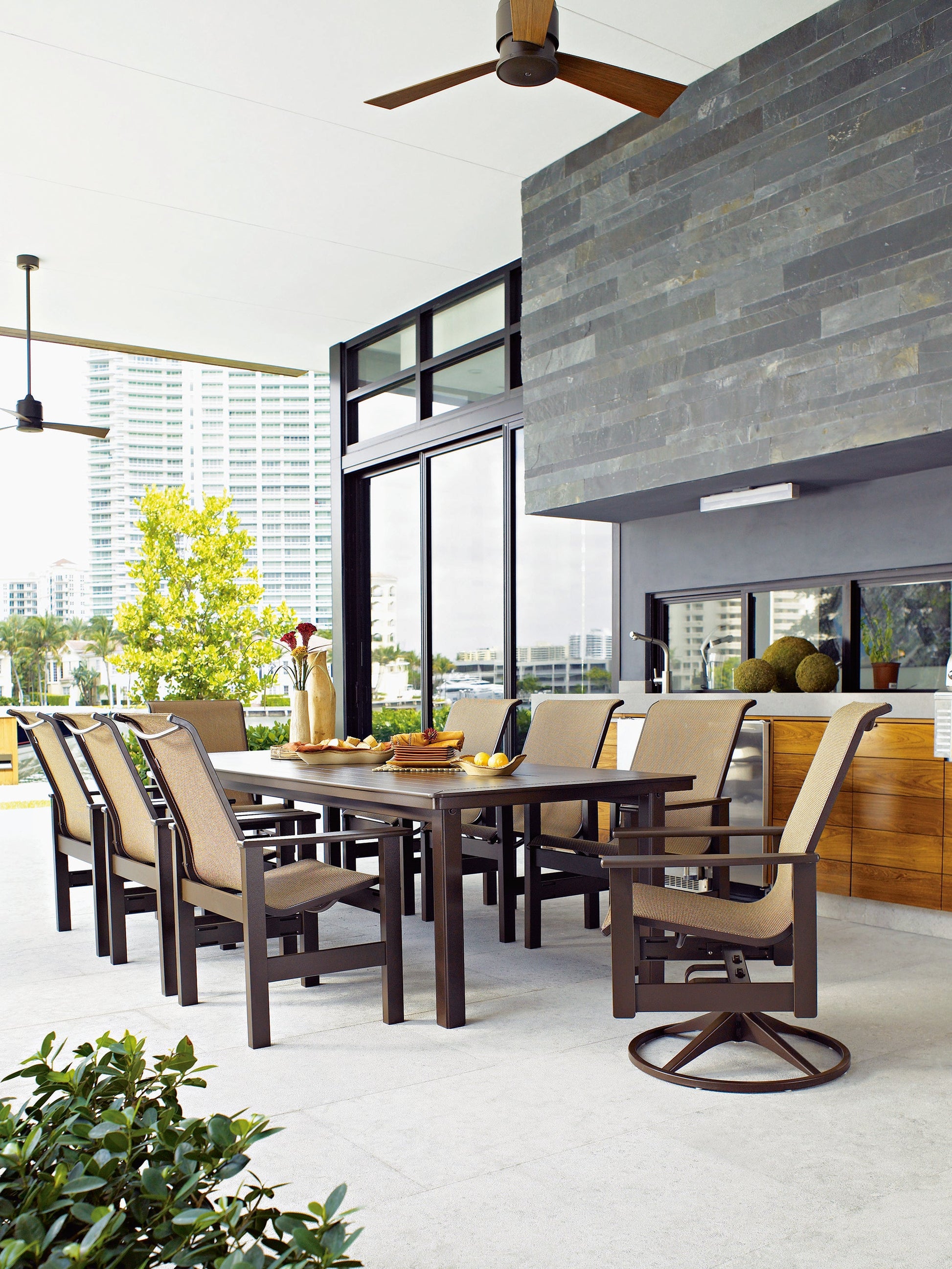 -Telescope Casual-Leeward Sling Swivel Rocker-Pangaea Patio-Lifestyle Image